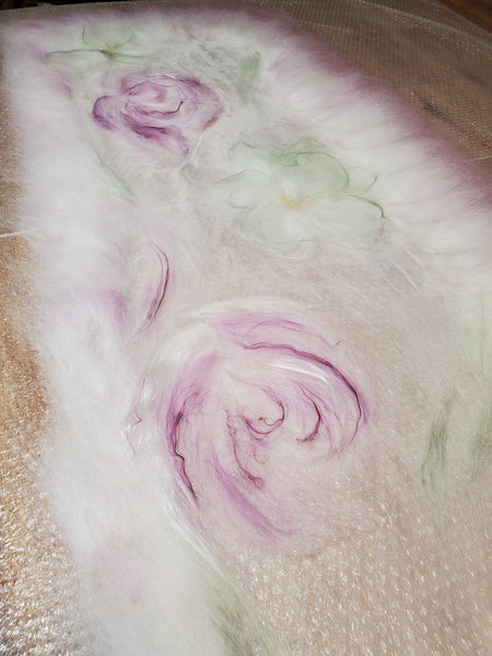 Scarf in soft pastel shades of cream, lavender, and sage green, delicate floral pattern in a romantic, bohemian style.